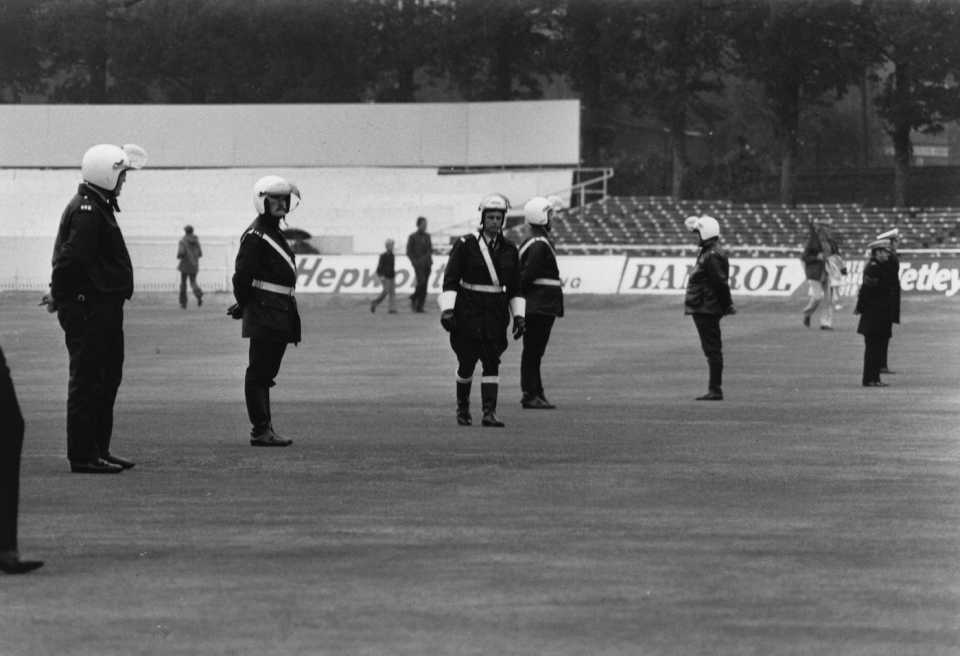 Policemen protect the Test Match pitch at Headingley