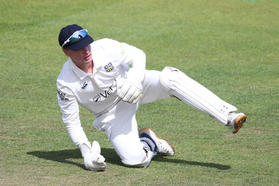 Tom Mackintosh, pictured while keeping wicket, is on first-class debut