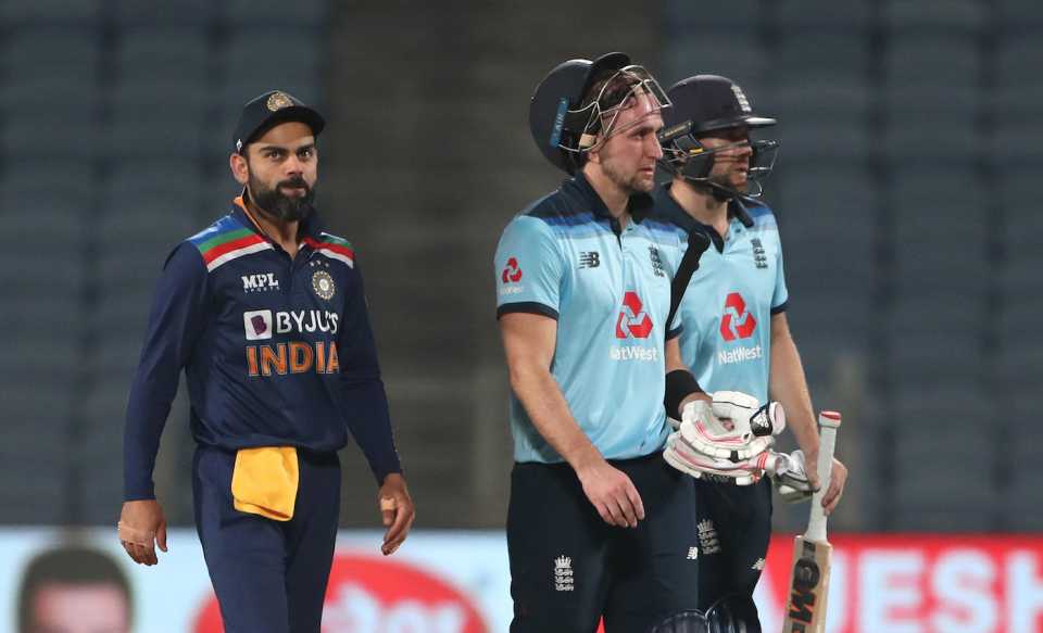 Virat Kohli, Liam Livingstone and Dawid Malan leave the field at the end of the game, India vs England, 2nd ODI, Pune, March 26, 2021
