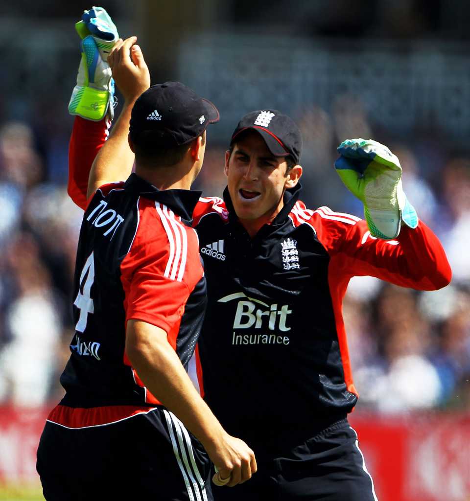 Jonathan Trott and Craig Kieswetter celebrate a wicket