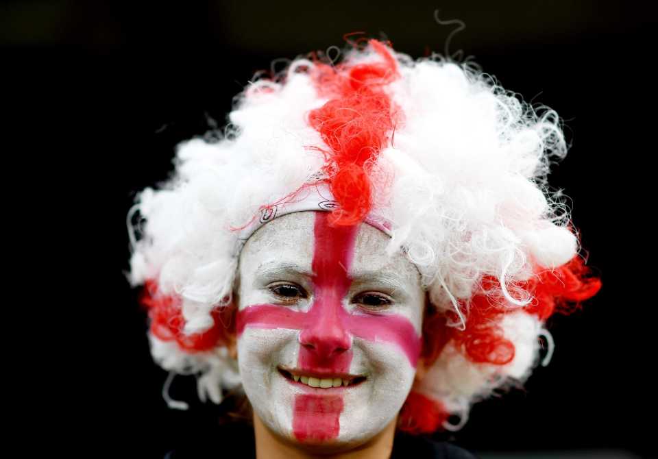 An England fan enjoys the game