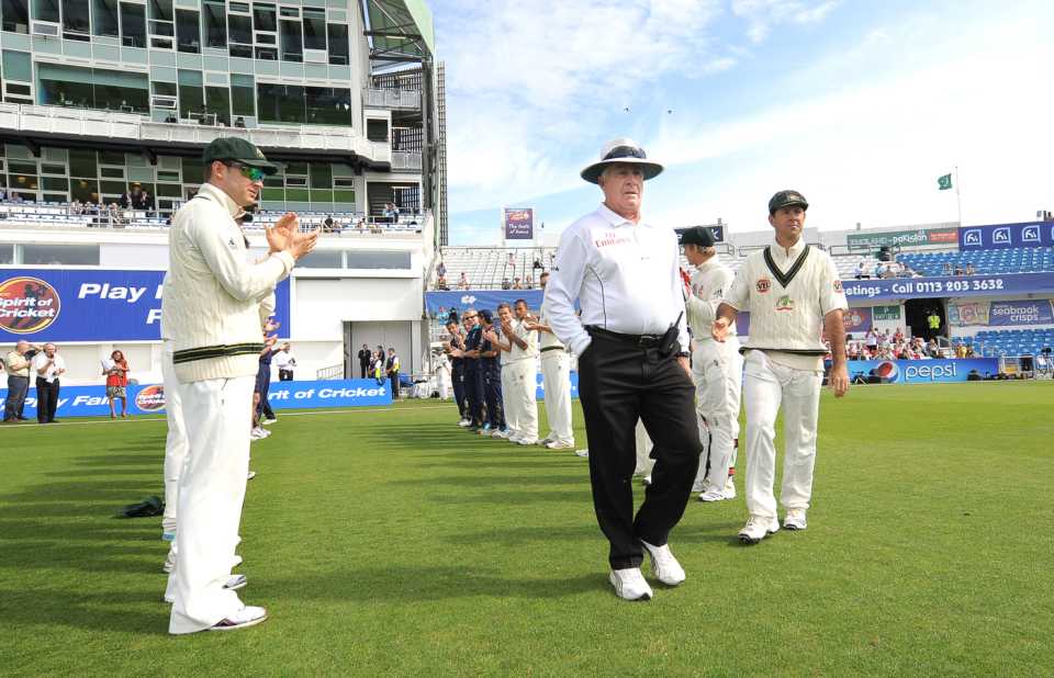 Umpire Rudi Koertzen gets a guard of honour as he walks out for the last time in Test cricket