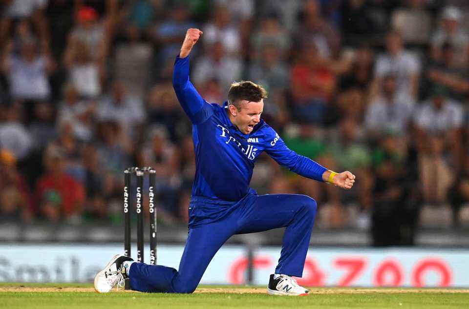 Mason Crane celebrates taking the wicket of Alex Davies