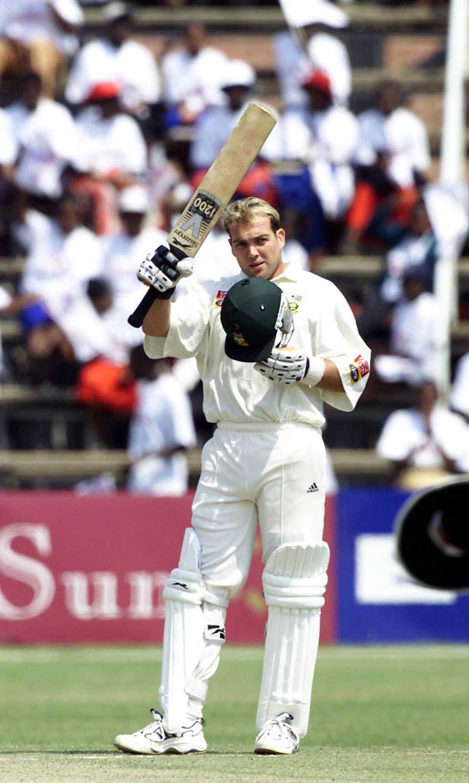 Jacques Kallis raises the bat after reaching a ton, Zimbabwe v South Africa, Queen's Sports Club , Bulawayo, 14- 18 Sept 2001