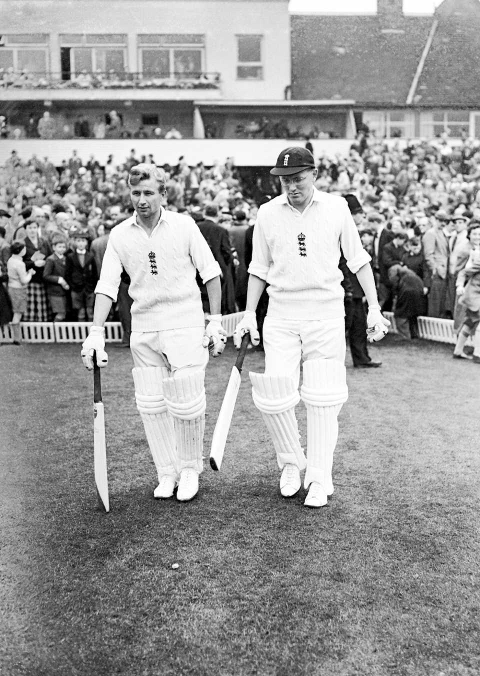 Arthur Milton and Mike Smith walk out to open the batting in England's first innings