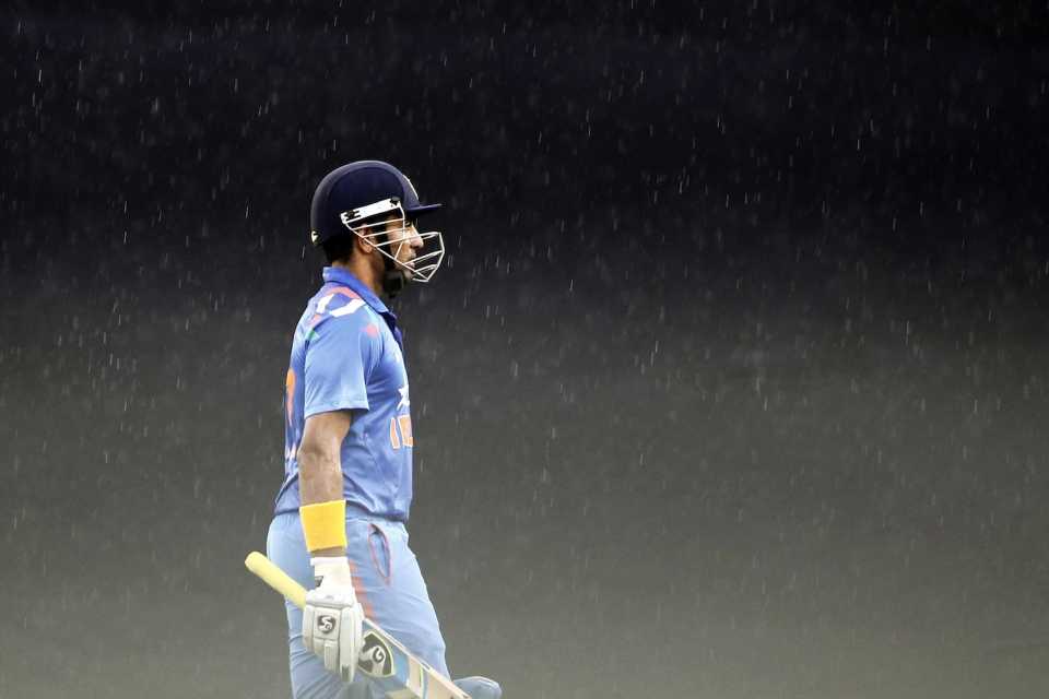 Robin Uthappa walks off the field as rain falls, Bangladesh v India, 2nd ODI, Mirpur, June 17, 2014