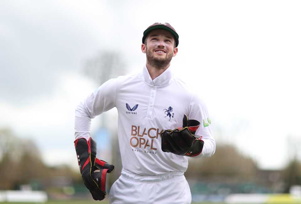 Ollie Robinson with his wicketkeeping gloves on