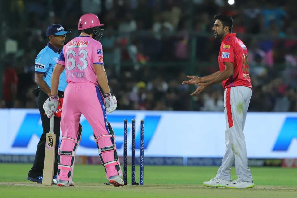 R Ashwin and Jos Buttler exchange words