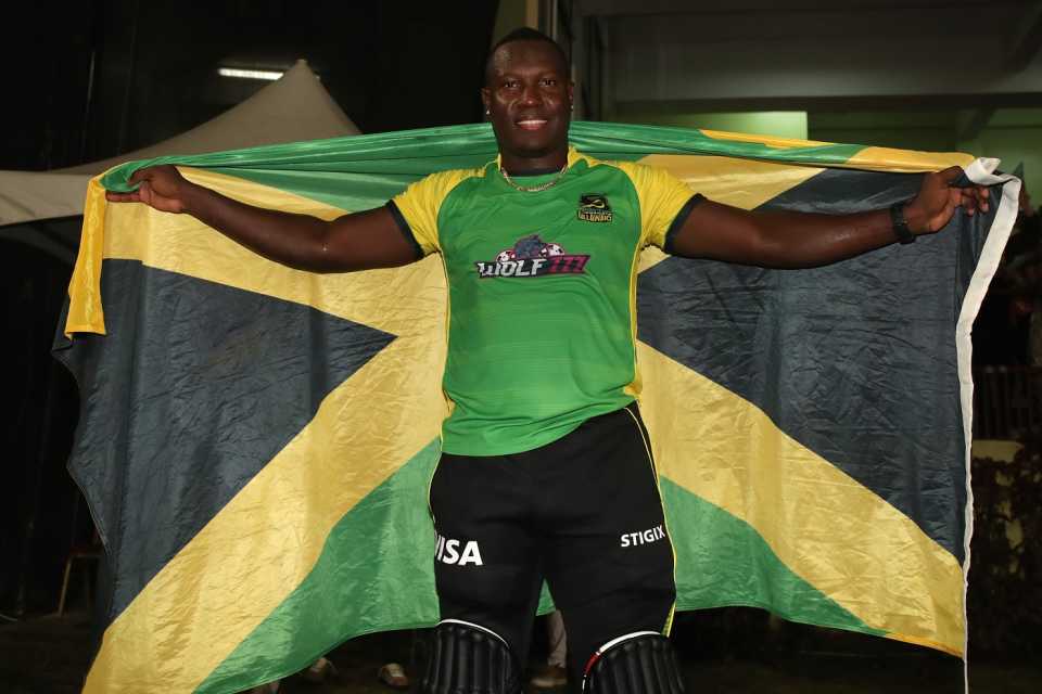 Rovman Powell poses with the Jamaica flag after winning CPL 2022, Barbados Royals vs Jamaica Tallawahs, Providence, CPL 2022, October 1, 2022