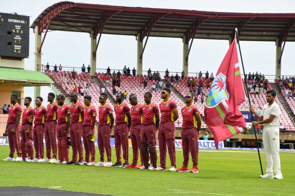 West Indies players get ready for their national anthem