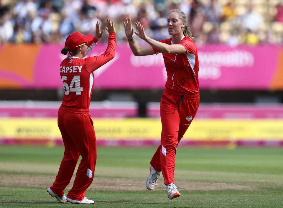 Freya Kemp celebrates a wicket with Alice Capsey