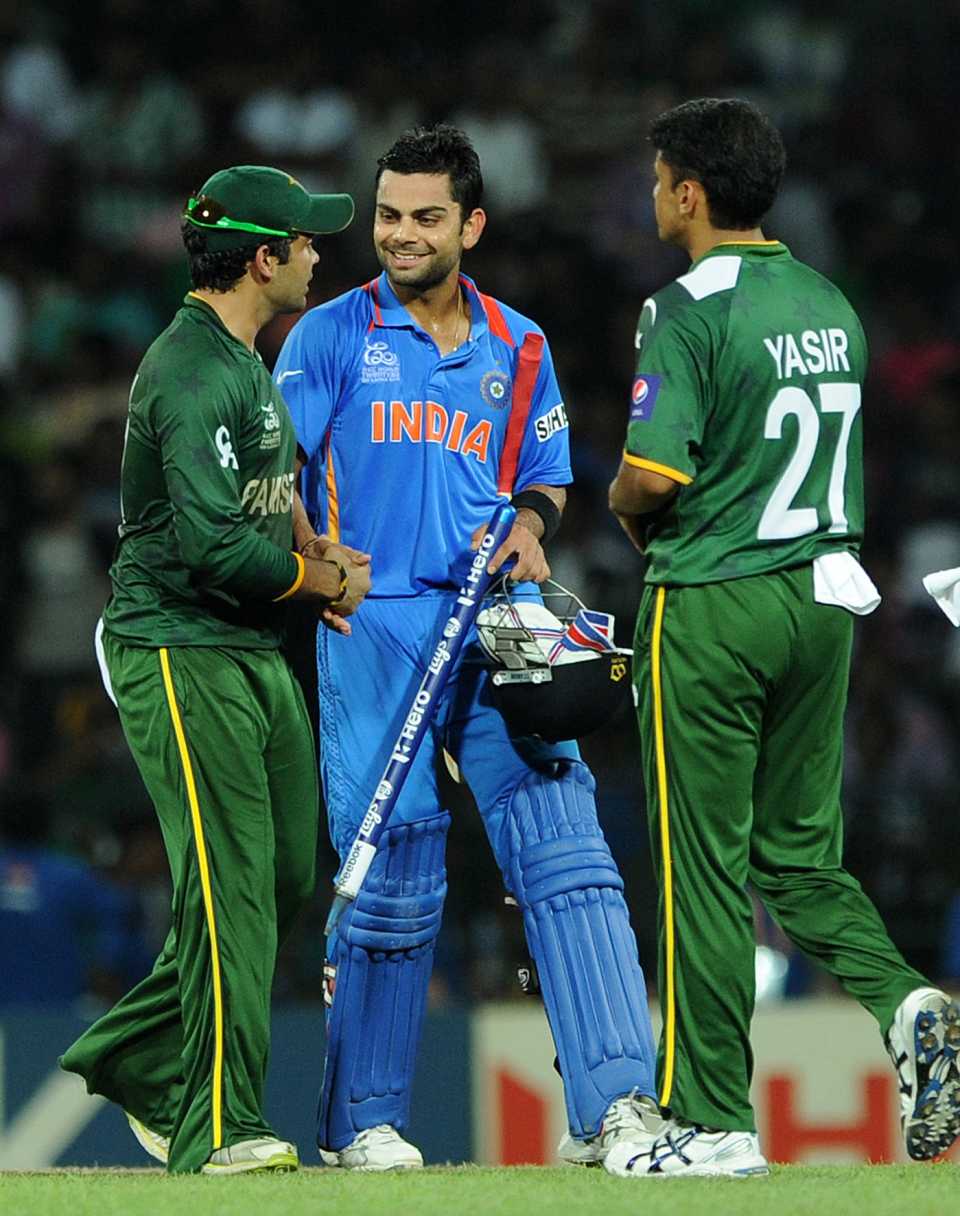 Umar Akmal and Yasir Arafat congratulate Virat Kohli after the win, India vs Pakistan, Colombo, T20 World Cup, September 30, 2012