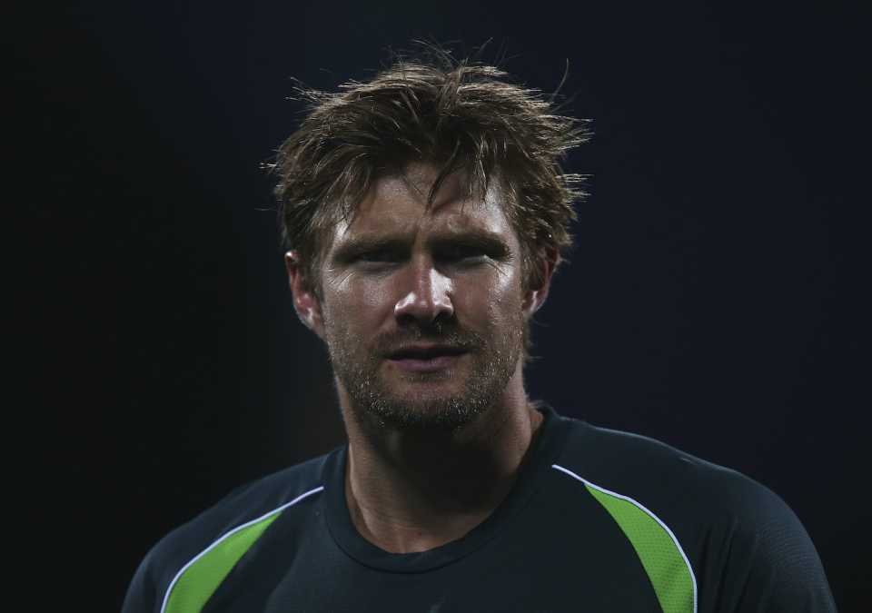 Shane Watson warms up before the match