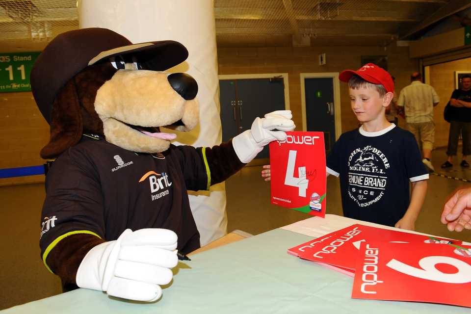 Surrey mascot Kenny Kennington signs autographs for fans