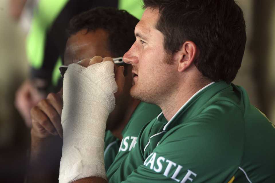 An injured Graeme Smith watches from the stands