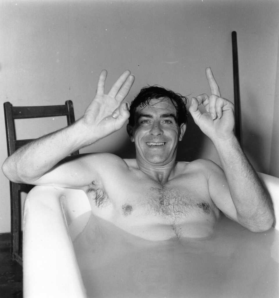 Fred Trueman relaxes in a bath in the pavilion after taking four Australian wickets, making his total 301