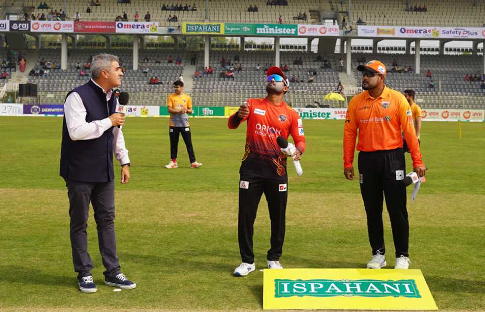 Imrul Kayes flips the coin as Yasir Ali looks on