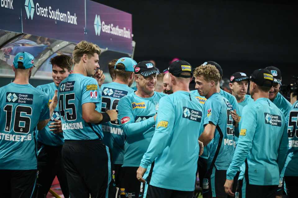 The Brisbane Heat players celebrate their win over Sydney Sixers