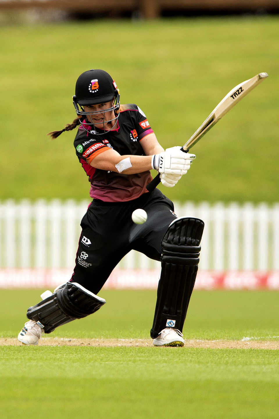 Kate Anderson smashes the ball towards the covers