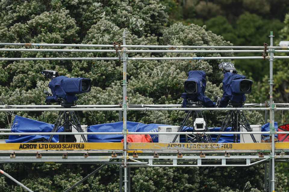TV cameras sit abandoned on top of the scaffolding due to strong winds