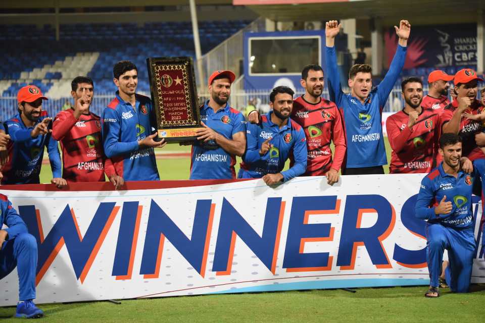 The Afghanistan players pose with the trophy, Afghanistan vs Pakistan, 3rd T20I, Sharjah, March 27, 2023