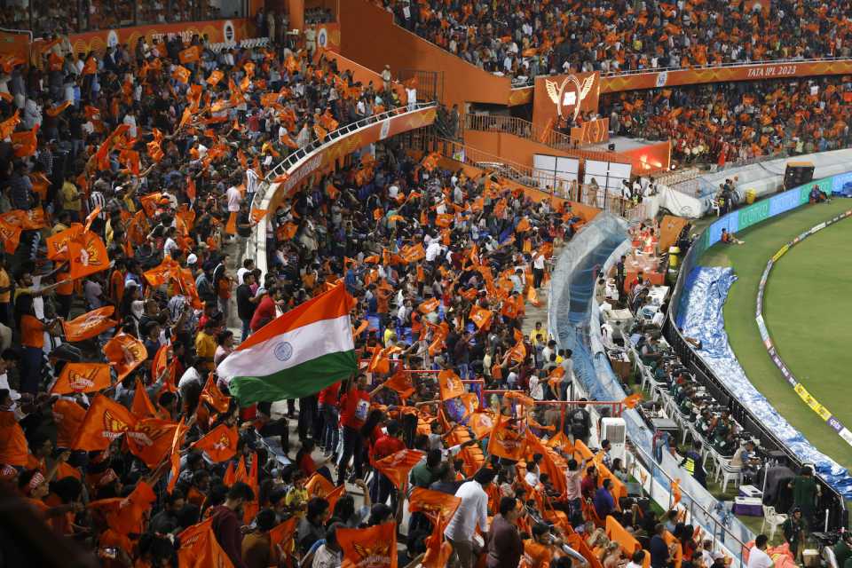 An India flag flies among a sea of orange in Hyderabad