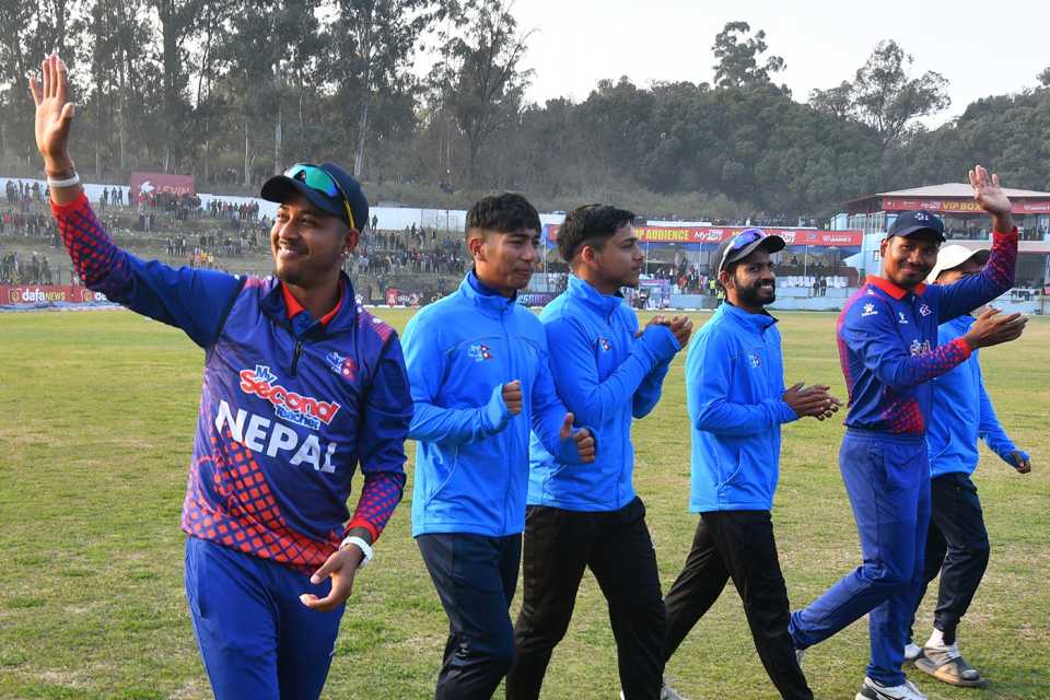 Nepal's players wave to fans after the win