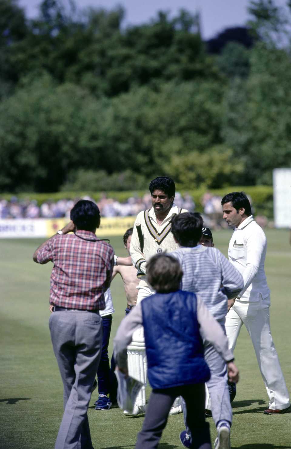 A handful of fans mob Kapil Dev after his 175 against Zimbabwe