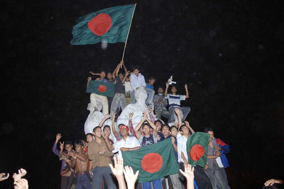 Bangladesh fans celebrate at the University campus in Dhaka