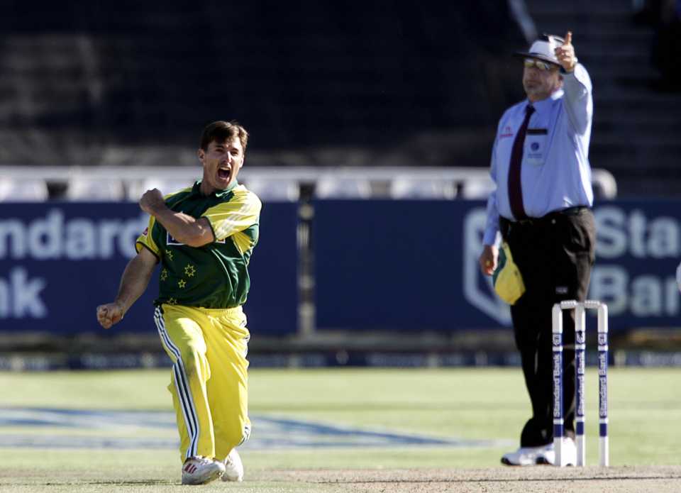 Brad Hogg celebrates a wicket