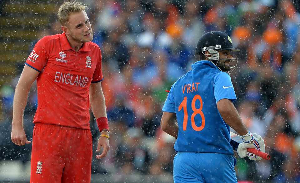 Virat Kohli runs past Stuart Broad in the rain, England v India, Champions Trophy final, Edgbaston, June 23, 2013