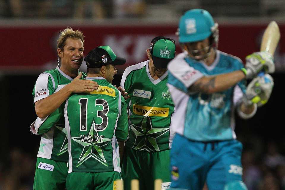 A mic-ed-up Shane Warne celebrates bowling Brendon McCullum after calling it on commentary