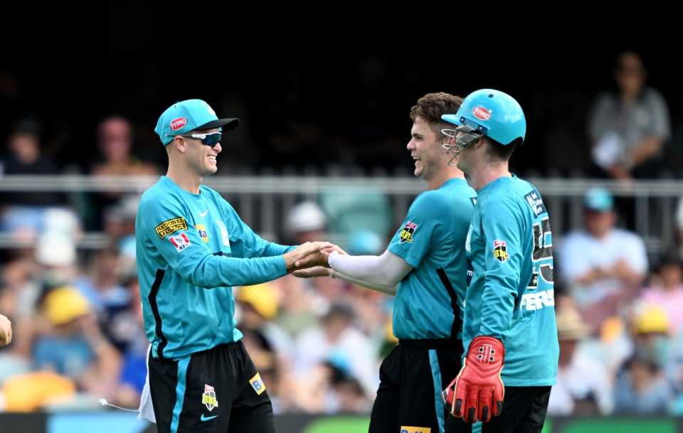Spinners Matt Kuhnemann (left) and Mitchell Swepson (middle) celebrate a wicket