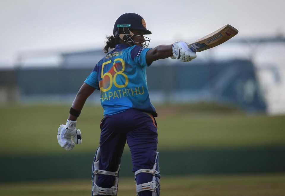 Chamari Athapaththu acknowledges the dressing room after getting to her century