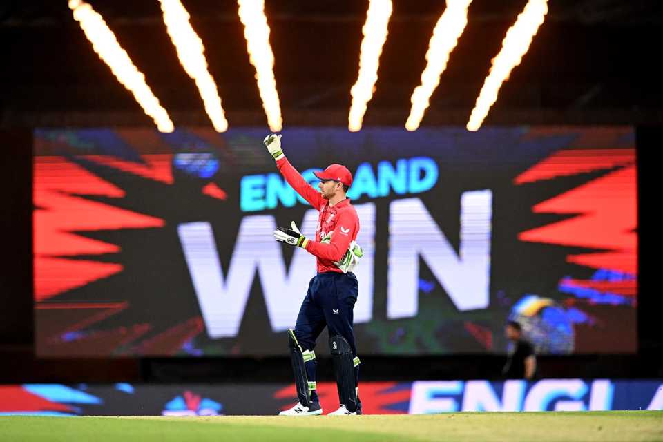 Jos Buttler stands in front of an "England win" sign, England vs New Zealand, T20 World Cup, Brisbane, November 1, 2022