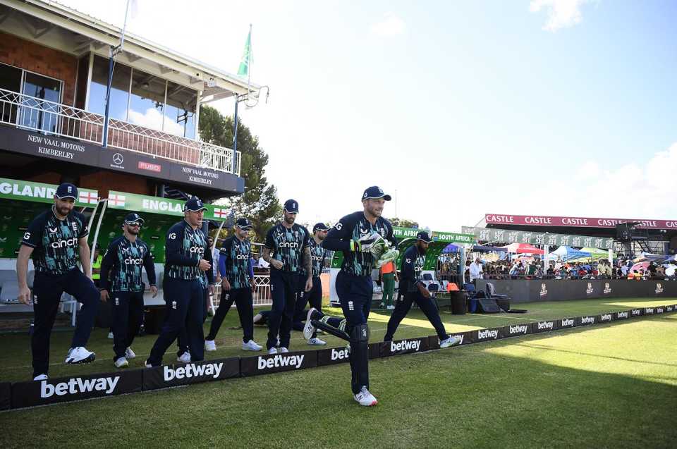 Jos Buttler leads his team out