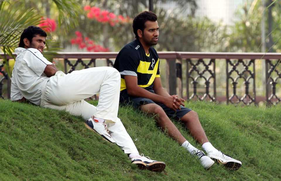 Abhishek Nayar watches the match with Rohit Sharma