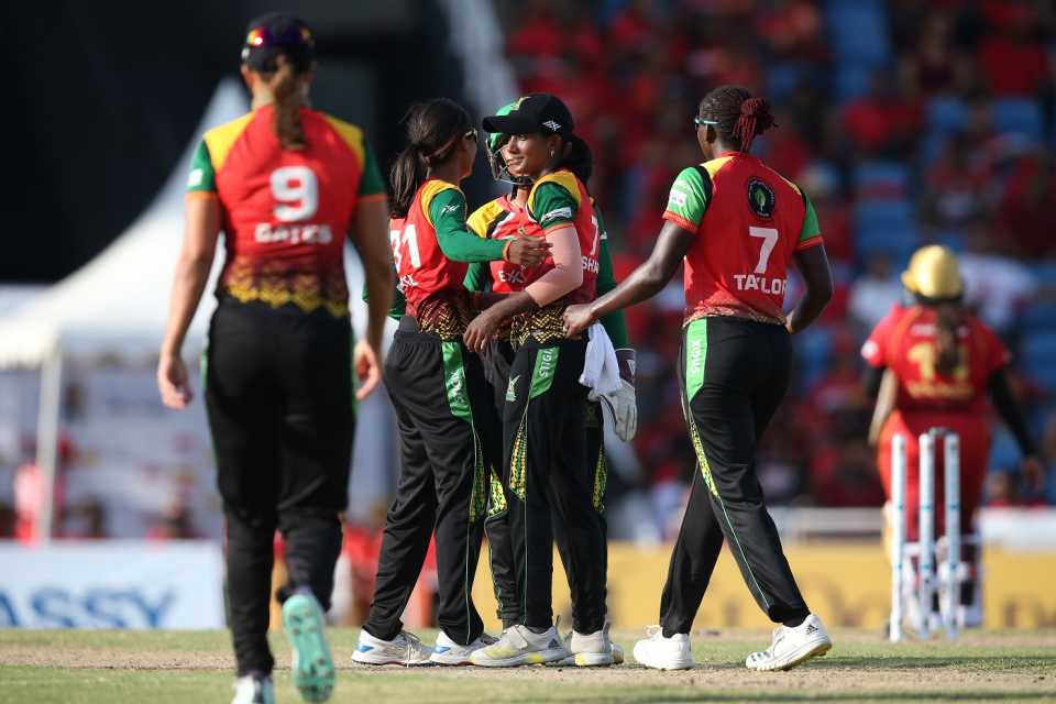 Karishma Ramharack celebrates with her team-mates after dismissing Anisa Mohammed