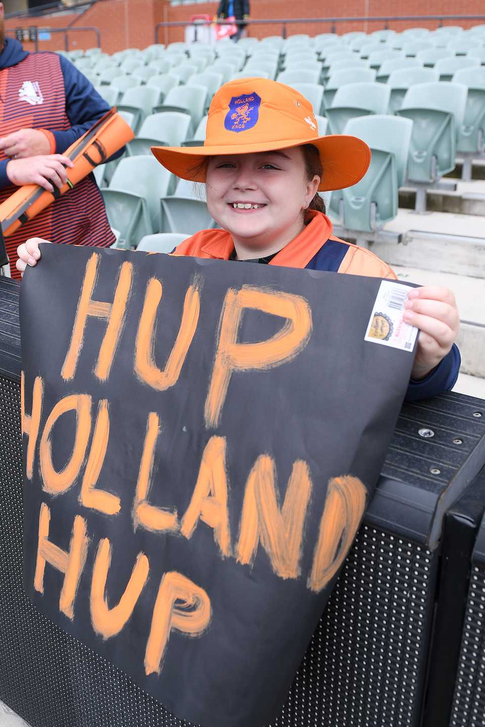 A Netherlands fan holds up a poster to show their support