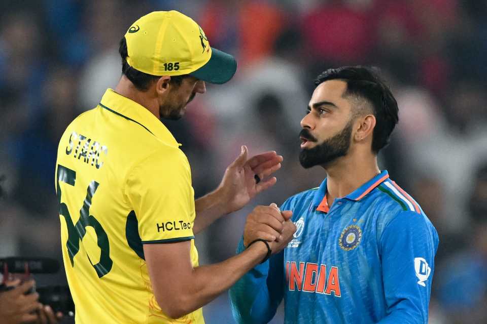 Mitchell Starc and Virat Kohli have a post-match chat
