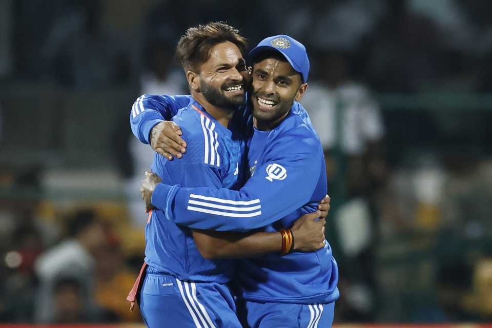 Mukesh Kumar is congratulated by his captain after picking two wickets in two balls