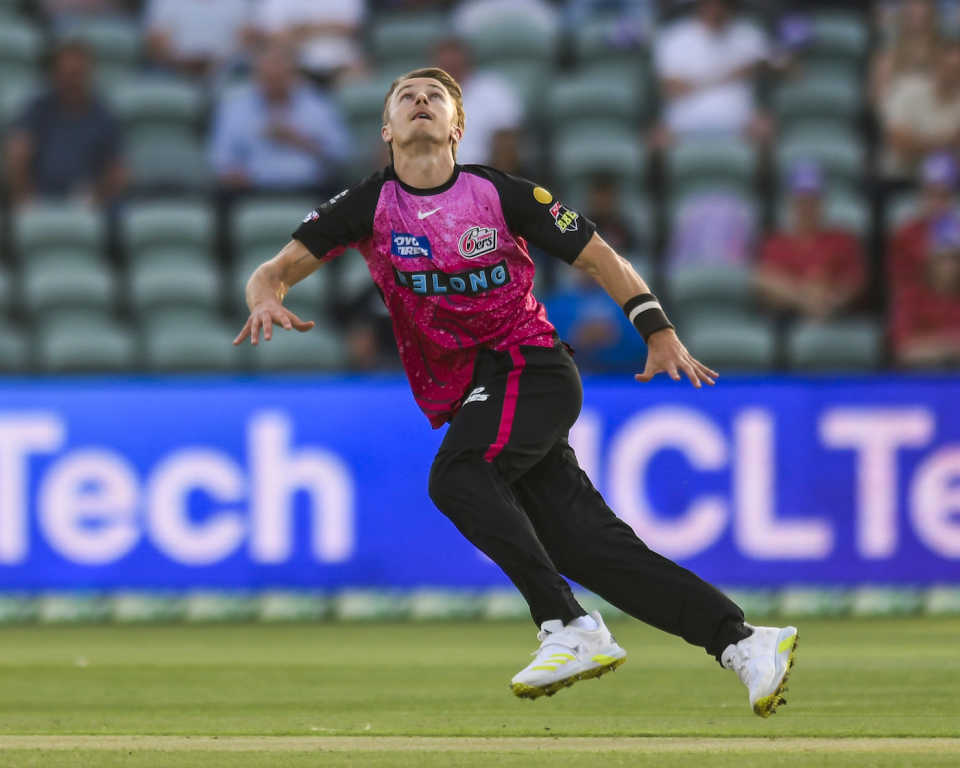 Tom Curran attempts a caught and bowled during Sydney Sixers' match against Hobart Hurricanes, BBL, Launceston, December 11, 2023