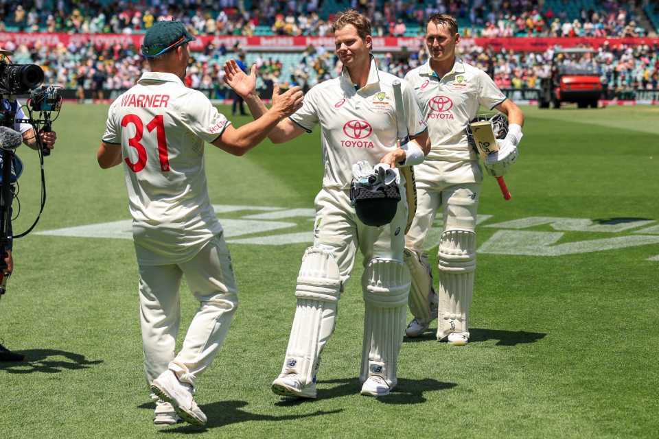 David Warner celebrates with Steven Smith after Australia's victory