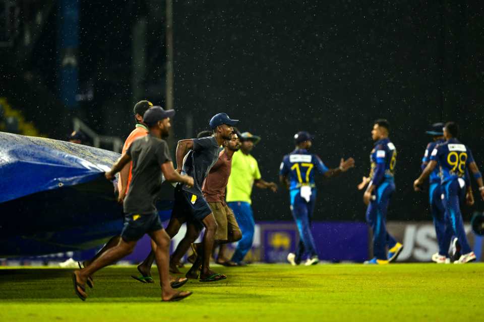 Members of the Colombo groundstaff get the covers on due to rain, Sri Lanka vs Zimbabwe, 1st ODI, Colombo, January 6, 2024