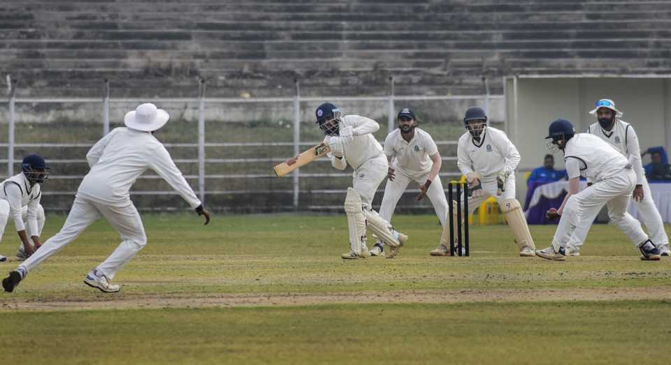 Bihar's Nawaz Khan taps the ball away
