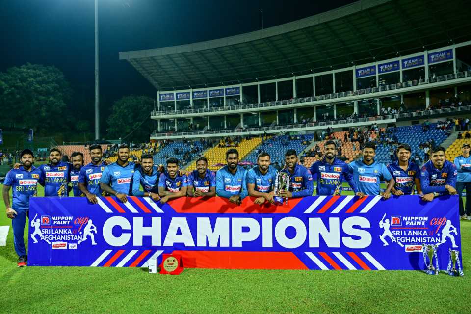 The victorious Sri Lanka squad with its spoils