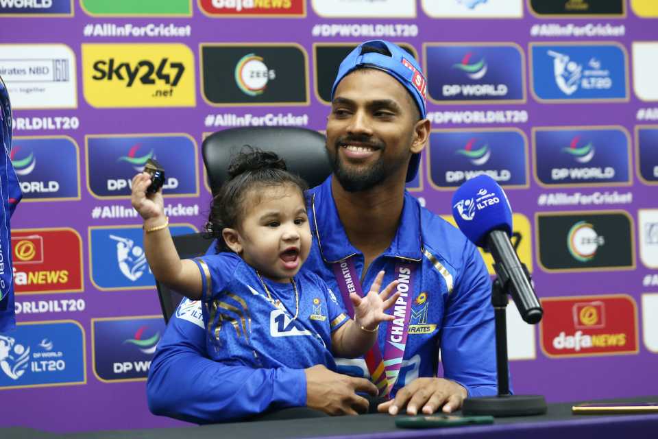 Nicholas Pooran and his daughter enjoy the post-win press conference