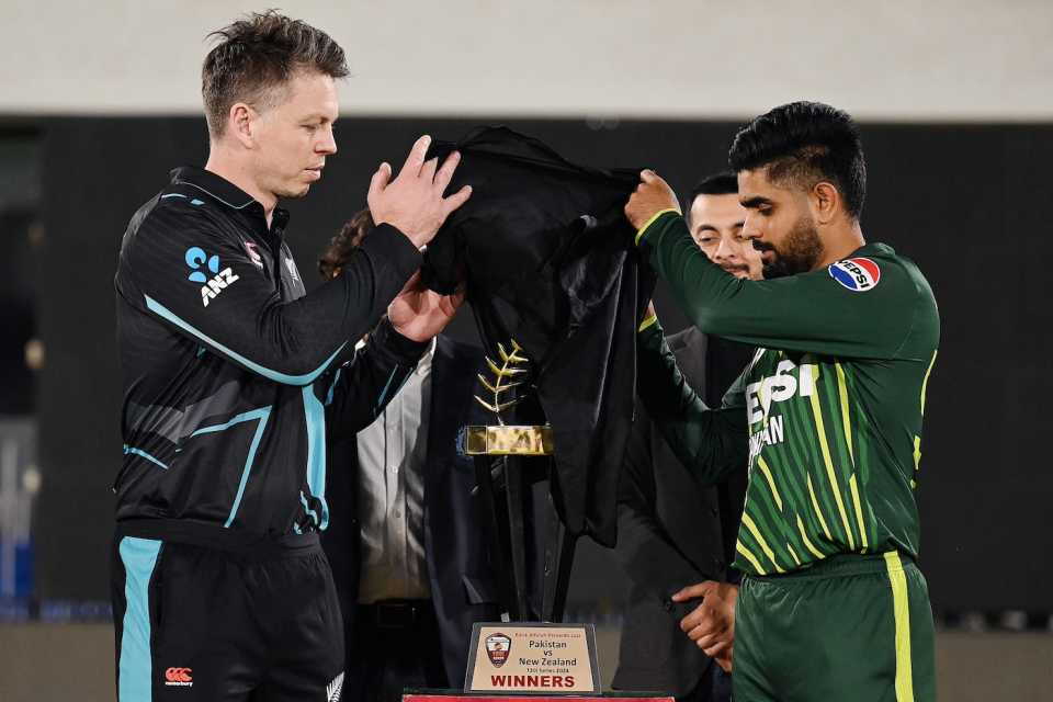 Michael Bracewell and Babar Azam unveil the trophy