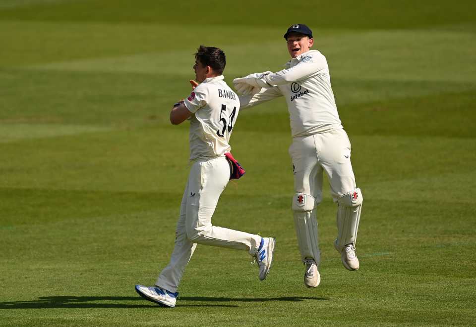 Ethan Bamber is congratulated by Jack Davies on the wicket of Harry Brook
