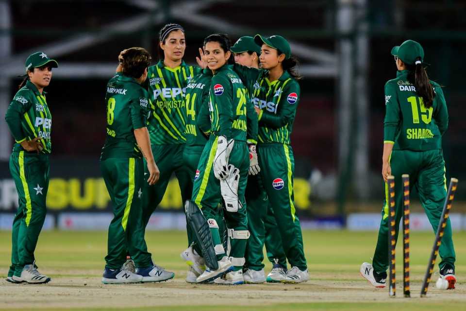 The Pakistan players celebrate the fall of Rashada Williams
